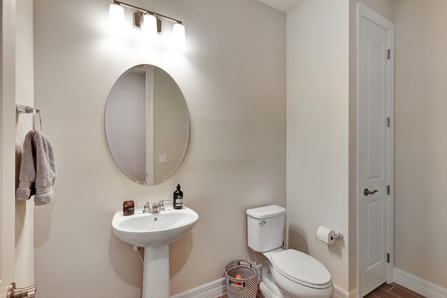 bathroom with sink and toilet