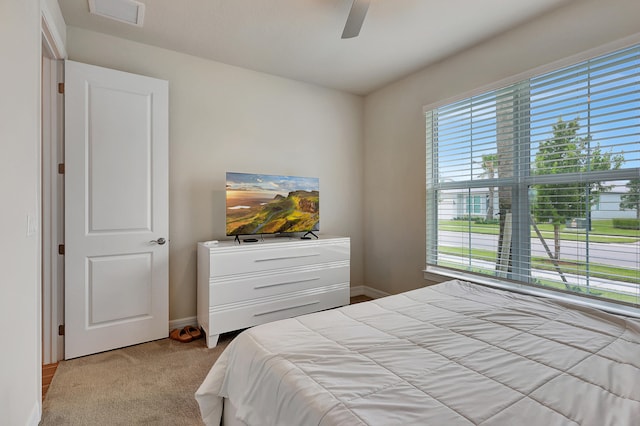 carpeted bedroom with ceiling fan