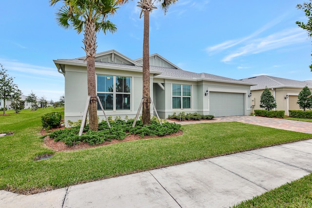 ranch-style house with a front yard and a garage