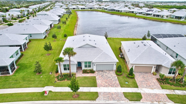 birds eye view of property with a water view