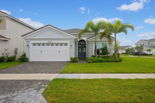 view of front facade featuring a front yard and a garage