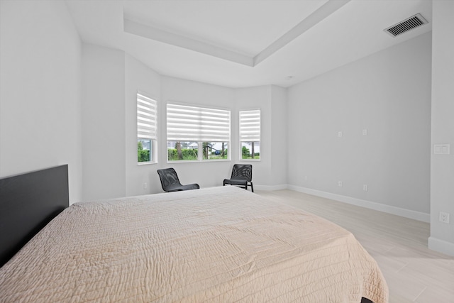 bedroom featuring a tray ceiling