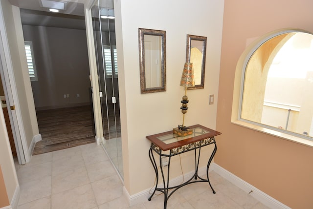 corridor featuring light tile patterned flooring