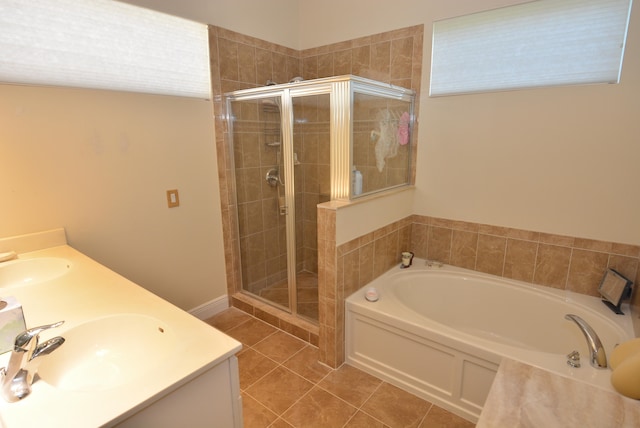 bathroom with tile patterned floors, vanity, and independent shower and bath