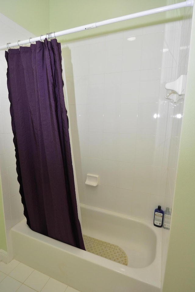 bathroom featuring tile patterned flooring and shower / bath combination with curtain