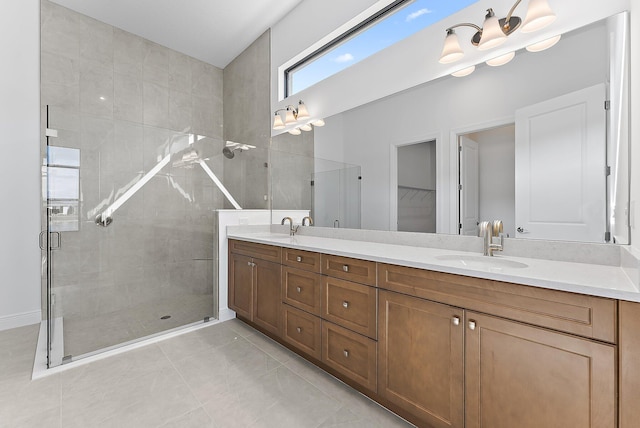 bathroom featuring walk in shower, vanity, and tile patterned flooring