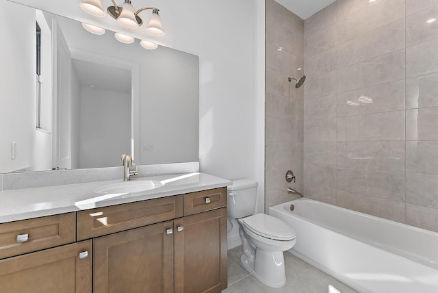 full bathroom featuring tile patterned floors, toilet, tiled shower / bath combo, and vanity