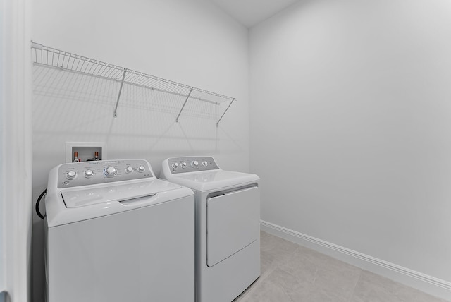 laundry area featuring independent washer and dryer