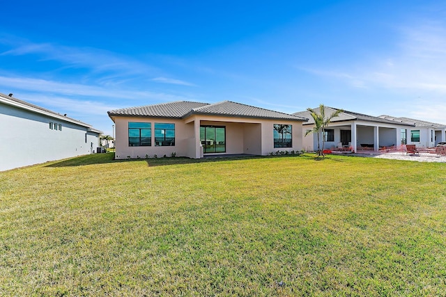 view of front of home with a front lawn