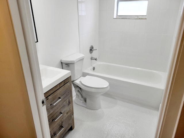 full bathroom featuring vanity, tiled shower / bath combo, toilet, and tile patterned floors