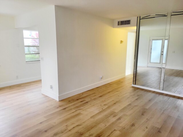 15 Burgundy Unit A, Delray Beach, FL 33484 - empty room featuring light wood finished floors, baseboards, and visible vents