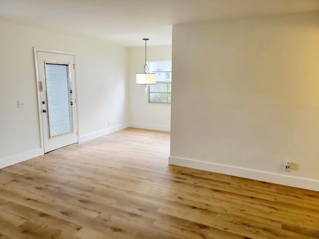 15 Burgundy Unit A, Delray Beach, FL 33484 - spare room with baseboards and light wood-style floors
