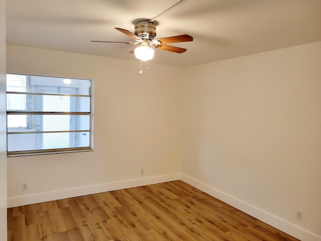 spare room with ceiling fan and hardwood / wood-style floors