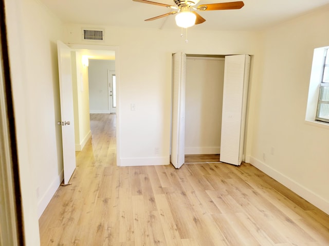 unfurnished bedroom featuring light hardwood / wood-style floors and ceiling fan