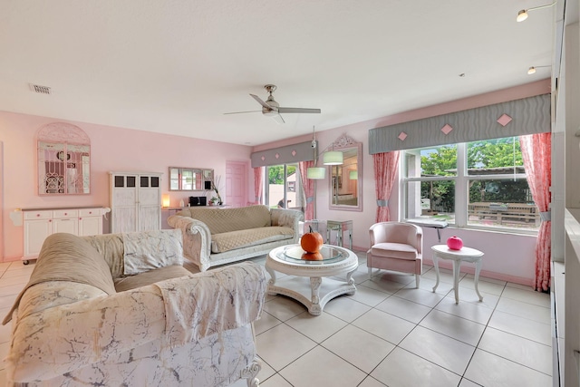 living room featuring light tile patterned flooring and ceiling fan