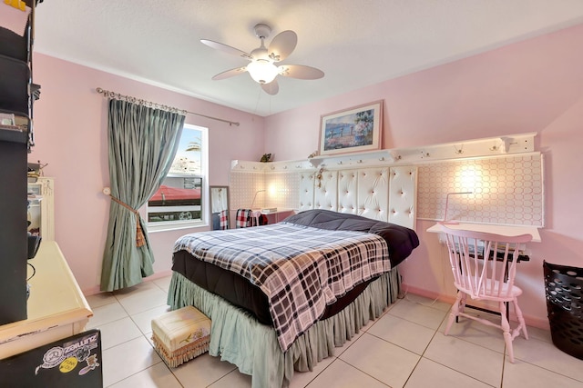 bedroom featuring ceiling fan and light tile patterned floors