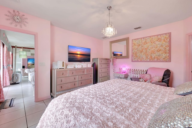 bedroom with a chandelier and light tile patterned floors