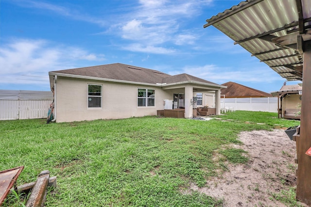 rear view of property featuring a patio, a yard, and a pergola