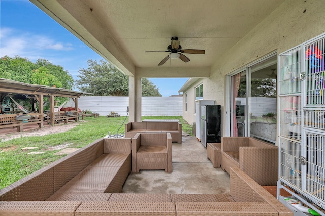 view of patio with ceiling fan and an outdoor living space