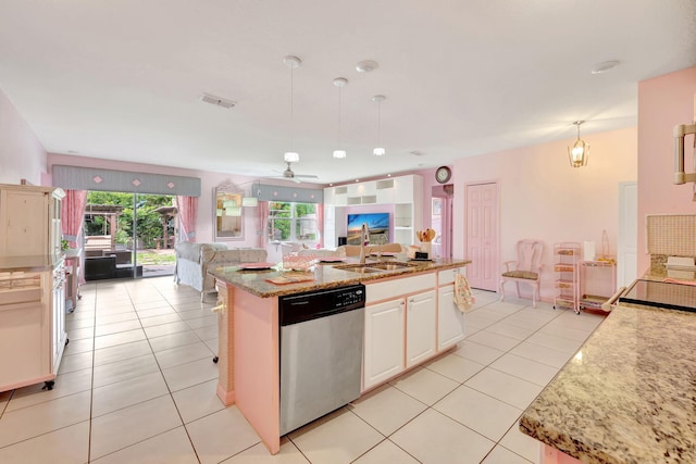 kitchen with pendant lighting, a center island with sink, sink, dishwasher, and light tile patterned floors