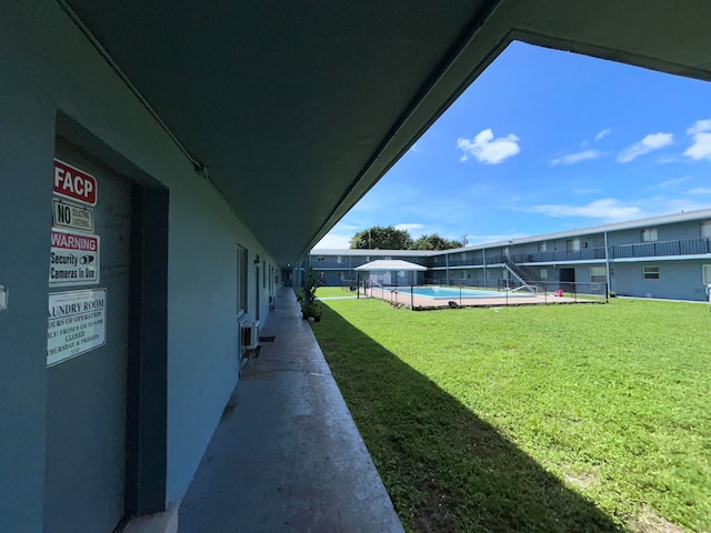 view of yard featuring a community pool