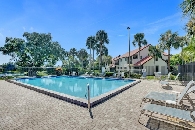 view of swimming pool with a patio