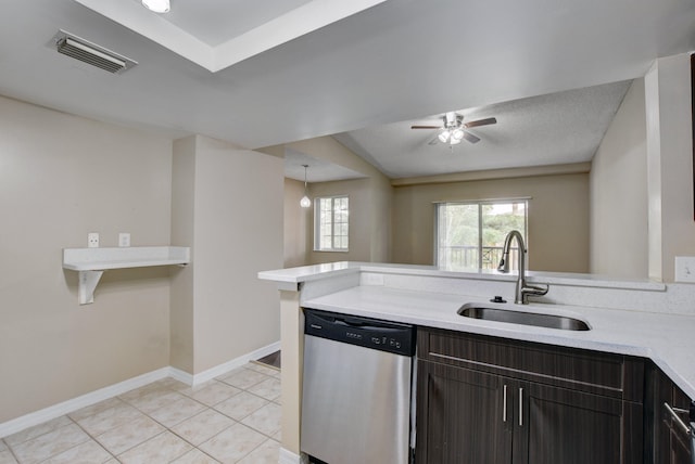 kitchen featuring ceiling fan, dark brown cabinetry, sink, light tile patterned flooring, and dishwasher