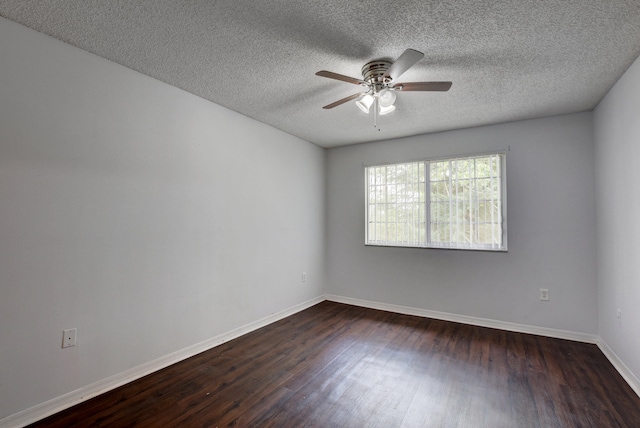 unfurnished room with dark wood-type flooring, ceiling fan, and a textured ceiling