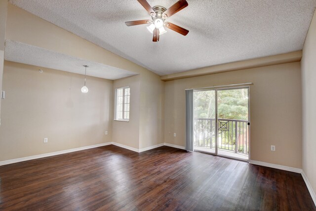 unfurnished room with ceiling fan, plenty of natural light, dark hardwood / wood-style floors, and a textured ceiling