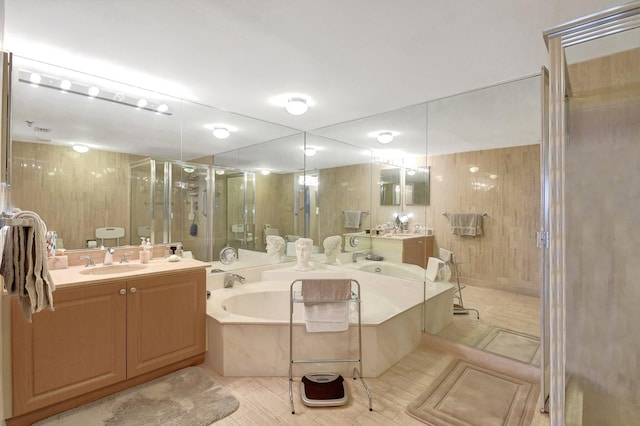 bathroom with vanity and plus walk in shower