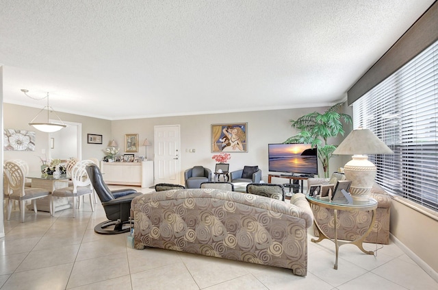 tiled living room featuring ornamental molding and a textured ceiling