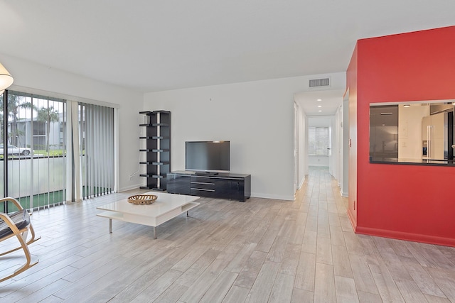 living room with light hardwood / wood-style flooring