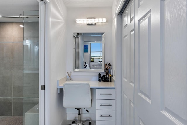 bathroom with a tile shower