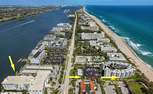 aerial view featuring a water view and a beach view