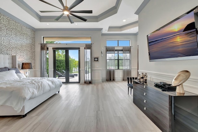 bedroom featuring multiple windows, ceiling fan, access to outside, and ornamental molding