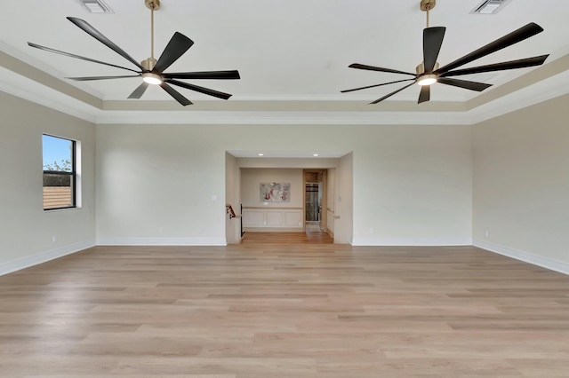 unfurnished living room with ceiling fan, light wood-type flooring, and crown molding