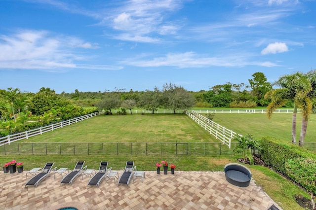 view of yard featuring a patio and a rural view