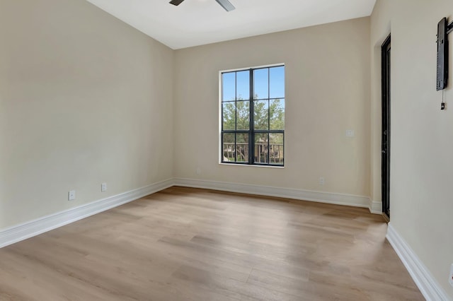 unfurnished room featuring ceiling fan and light hardwood / wood-style flooring