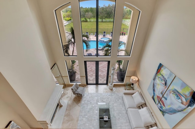 entrance foyer with a towering ceiling and french doors