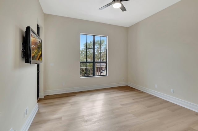 spare room featuring ceiling fan and light hardwood / wood-style flooring