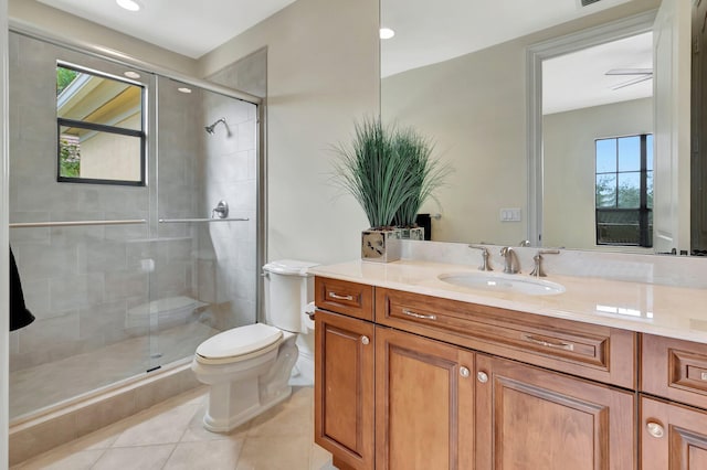 bathroom featuring toilet, walk in shower, tile patterned floors, and a healthy amount of sunlight