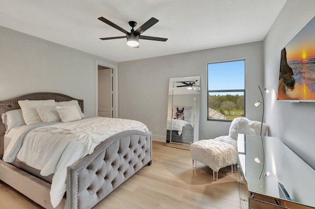 bedroom featuring ceiling fan and light wood-type flooring