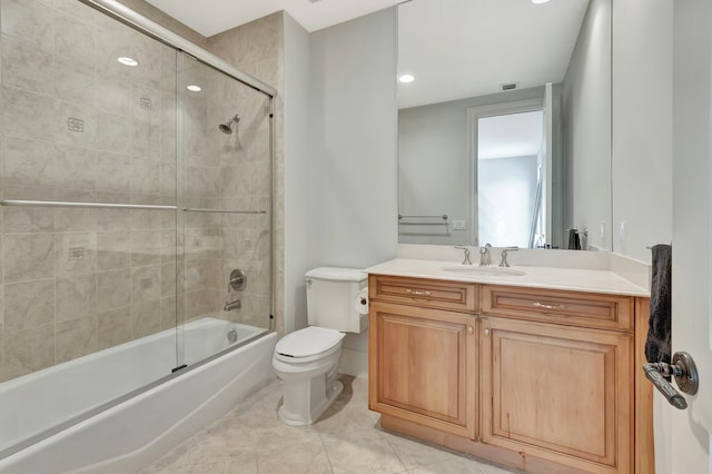 full bathroom with shower / bath combination with glass door, toilet, tile patterned floors, and vanity