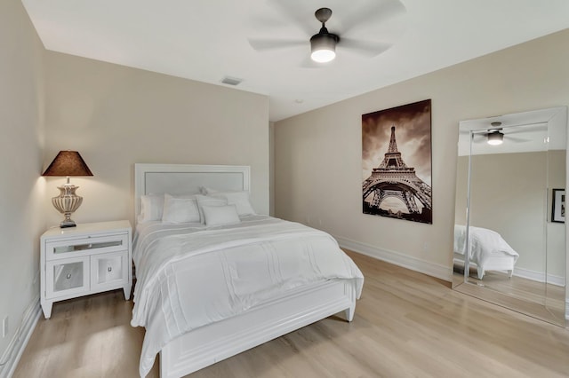 bedroom featuring ceiling fan and light hardwood / wood-style flooring