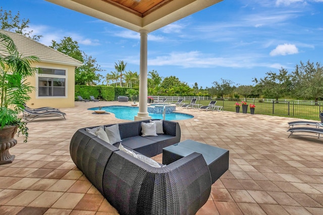 view of patio / terrace with an outdoor hangout area and a fenced in pool