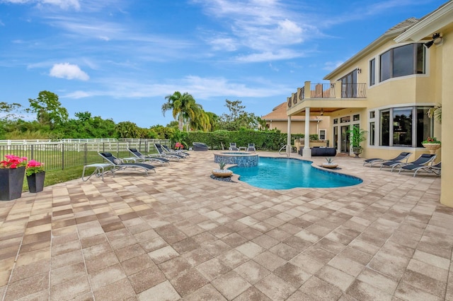 view of pool featuring an in ground hot tub and a patio area