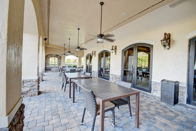 view of patio featuring ceiling fan and french doors