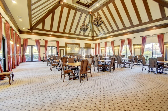 dining room featuring a high ceiling, light colored carpet, and an inviting chandelier