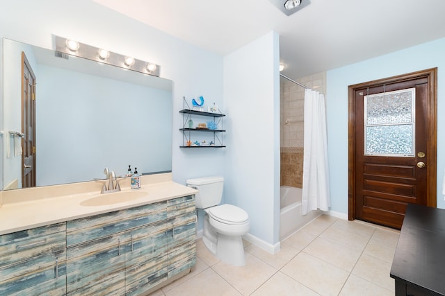 full bathroom featuring vanity, shower / bath combo with shower curtain, toilet, and tile patterned floors