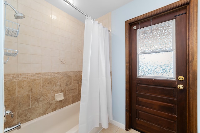 bathroom with shower / tub combo and tile patterned flooring